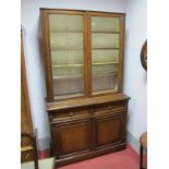 Early XX Century Oak Bookcase, with a glazed top, adjustable shelves, base with two small drawers,