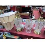 A Pair of Cut Glass Table Lamps, with brass collars, on brass stepped bases, together with a glass