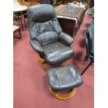 Brown Leather Adjustable Easy Chair, on circular base and matching footstool. (2)