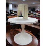 A Late 1960's / early 1970's white plastic /fibre glass table, circular top on an in curved support,