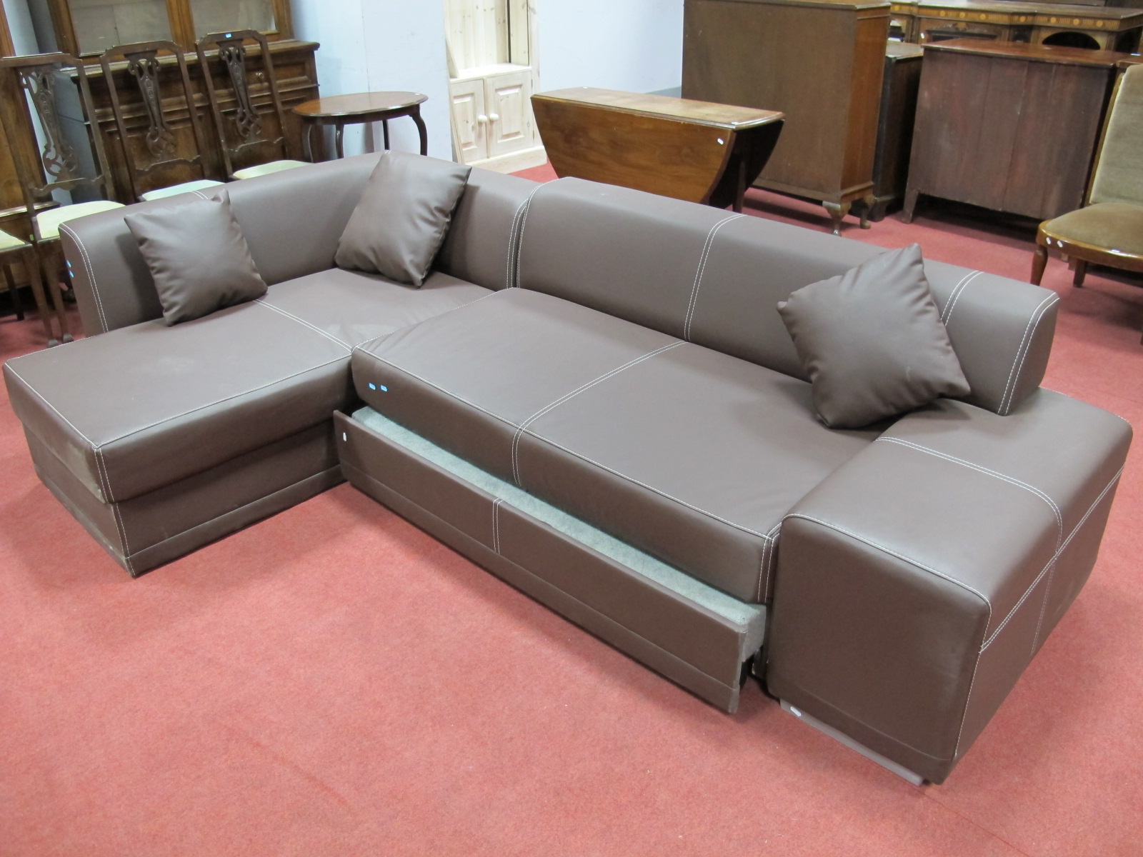 Brown Leather Lounge Corner Suite, with white stitched decoration.