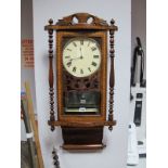 Late XIX Century Walnut Inlaid Wall Clock, with an applied pediment, white dial, glazed door, turned