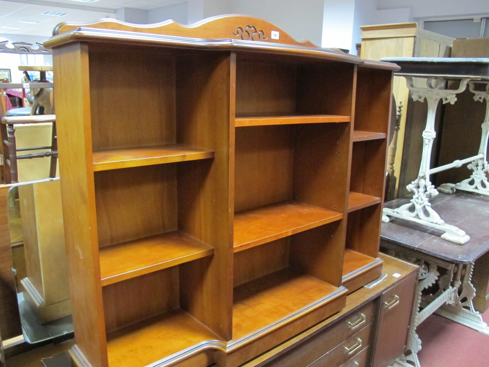 Mahogany Effect Breakfront Bookcase, with a low shaped back, moulded edge, open shelves, plinth