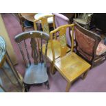 An Early XX Century Elm Nursing Chair, and a pair of hardwood dining chairs, each with pierced,