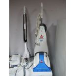 A Bissell Powerwash Deluxe, and a Pifico multi function steam mop. (2)