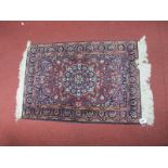 A Kashmir Style Part Silk Rug, the wine red field with central floral medallion, the herati-