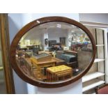 Early XX Century Mahogany Oval Shaped Wall Mirror, with a bevelled glass.