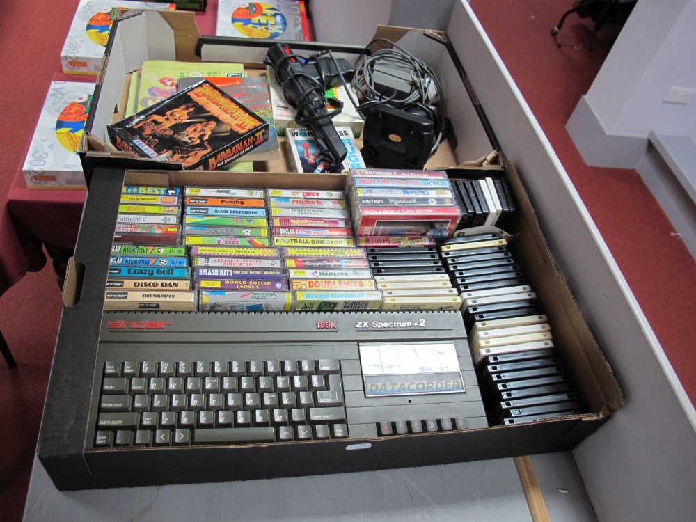 An Original Sinclair 2x Spectrum +2, 128k, with P.S.U., joystick and pistol, with forty three
