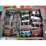 A Box of Mainly Post War "O" Gauge Four Wheeled Wagons and Coaches, plus other associated items.