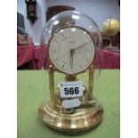 XX Century Bentima Mantel Clock, under a glass dome.