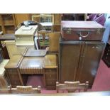 A 1930's Oak Two Piece Bedroom Suite, comprising compaction and dressing table. (2)