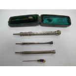 A Tie Pin, in fitted case, together with another tie pin, a hallmarked silver sliding pencil etc.