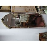 An Arched Wall Mirror, bevelled glass with amber glass borders, applied gilt scrolled cresting,