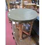 XX Century Chinese Brass Engraved Circular Table Top, on folding turned and block supports. (2)