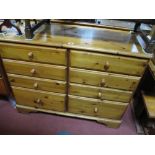 A Modern Pine Chest, incorporating two banks of four drawers, bracket feet.