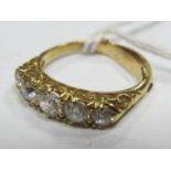 An 18ct Gold Five Stone Diamond Ring, the graduated old cut stones claw set within scroll carved
