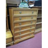 Chest of Drawers, with a moulded edge, six long drawers, on basket feet.