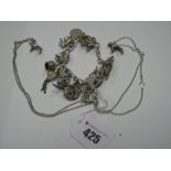 A Curb Link Charm Bracelet, suspending numerous novelty charm pendants; together with two dog