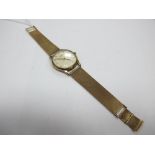 Longines; A 9ct Gold Gents Wristwatch, the signed dial with Arabic numerals and dagger markers,