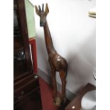 Large Carved Hardwood Figure, of Giraffe, with stained spots, on oval base, 155cms high.