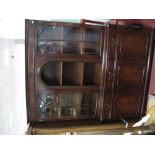 A Reproduction Mahogany Wall Unit, dentil cornice over twin arched glazed doors flanking central