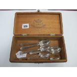 A Set of Six Hallmarked Silver Teaspoons, each initialled "W", contained in a wooden box.