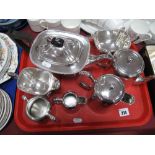 A J.T. & Co. Plated Three Piece Tea Set, a spoon and a hotel style four piece tea set:- One Tray