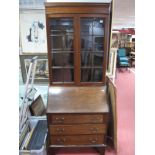 An Early XX Century Mahogany Bureau Bookcase, moulded top over twin glazed door, all above fall