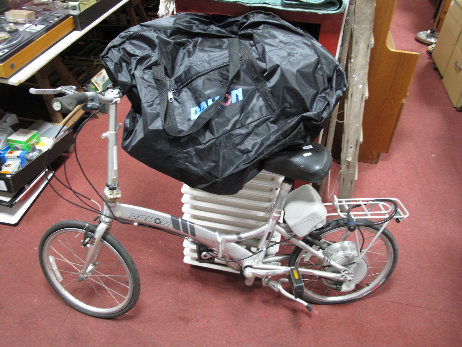 A Dahon Roo Electric Folding Bicycle, in grey, (replacement users manual), with protective