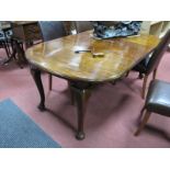 An Early XX Century Mahogany Dining Table, the oval top with moulded edge, on cabriole legs and