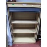 A Modern office Cupboard, plastic tambour front shutter with adjustable shelving.