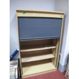 A Modern office Cupboard, plastic tambour front shutter with adjustable shelving.