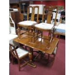 An Oak Veneered Drop Leaf Dining Table, and four oak dining chairs, solid splats. (5)