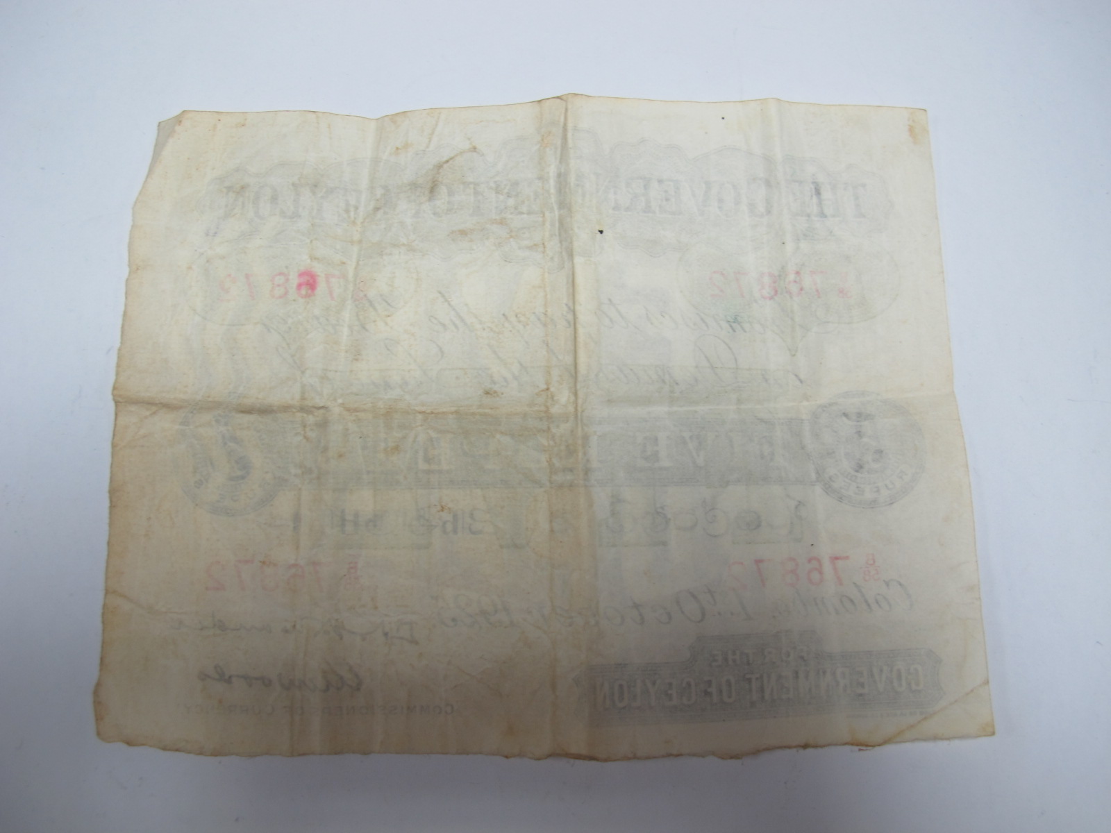 A Government of Ceylon Five Rupee Banknote, Colombo, 1st October 1925. Number B58 76872. Much folded - Image 2 of 7