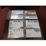 115 Royal Mail First Day Covers, in two albums, typed addressee, 1985-1997,