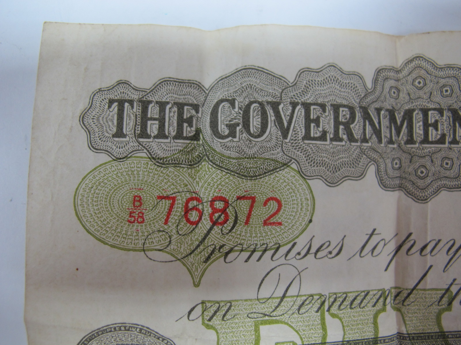 A Government of Ceylon Five Rupee Banknote, Colombo, 1st October 1925. Number B58 76872. Much folded - Image 4 of 7