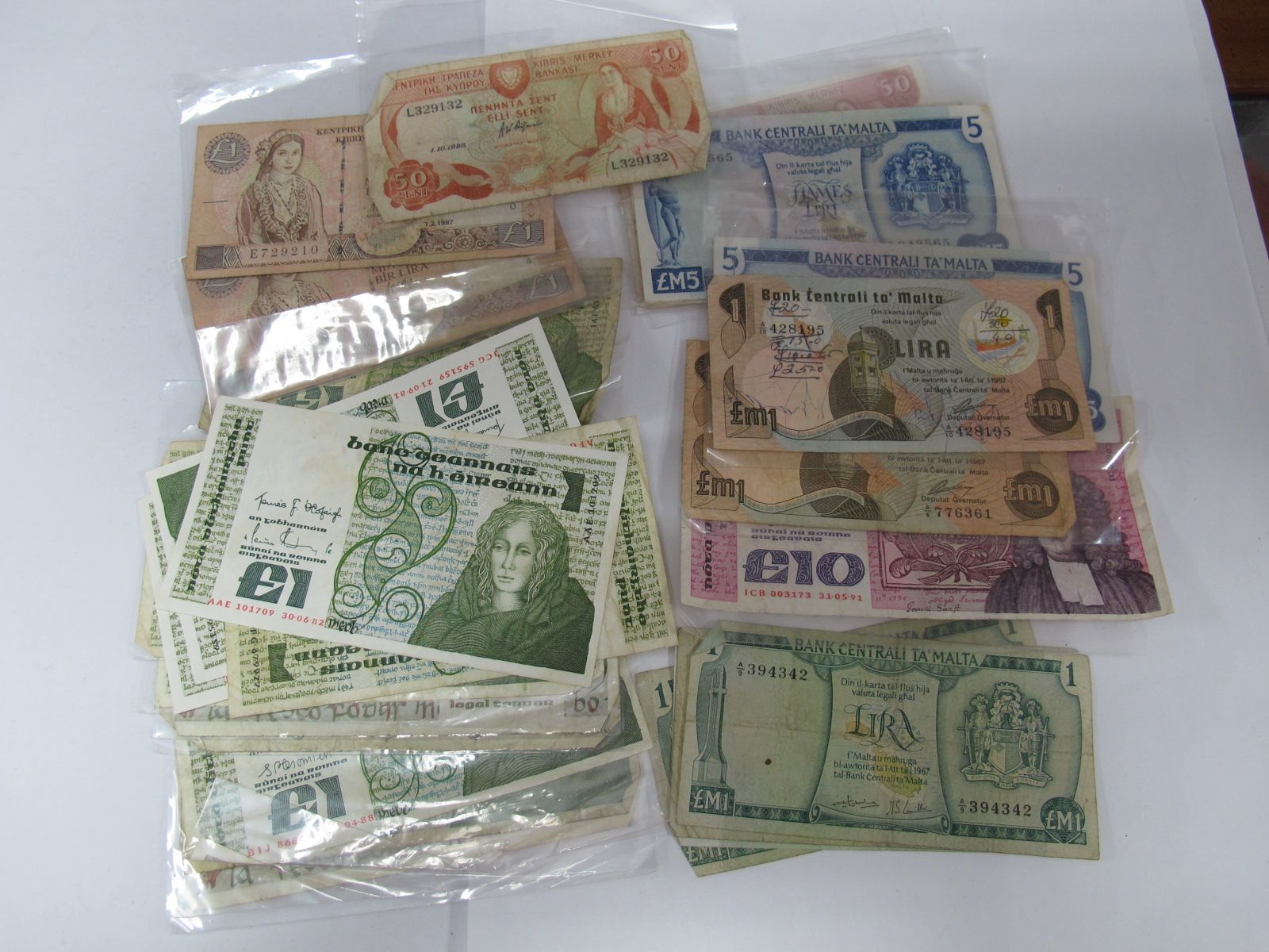 Twenty-Two Irish Punts, six Cyprus pounds and sixteen Maltese Lira. All in banknotes.