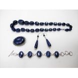 A Modern Lapis Lazuli Bead Necklace, together with a bracelet, oval collet set, a pair of drop