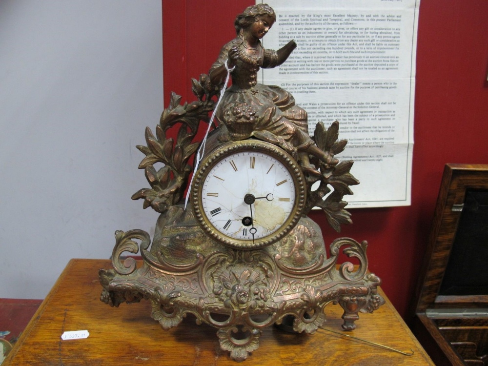 XIX Century French gilt Mantel Clock, of a female on top of clock dial, with foliage, enamel