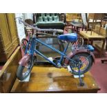 A Circa 1960's Childs Raleigh Bicycle, with stabilizers, in blue with maroon mudgaurds.