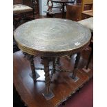 XX Century Moroccan Brass Table, with a circular engraved top on 'X' stretcher base with barley