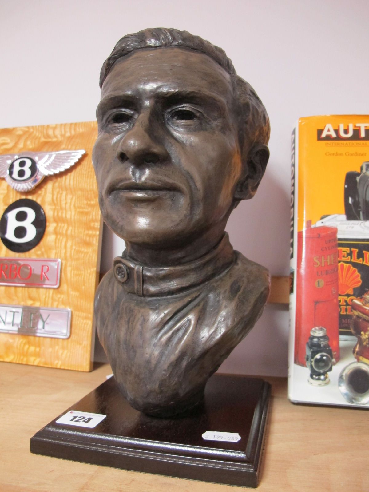 After Peter Close, a Bronzed Effect Bust Sculpture, of racing driving Jim Clark, 32cms high.