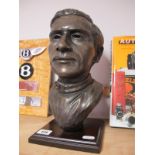 After Peter Close, a Bronzed Effect Bust Sculpture, of racing driving Jim Clark, 32cms high.