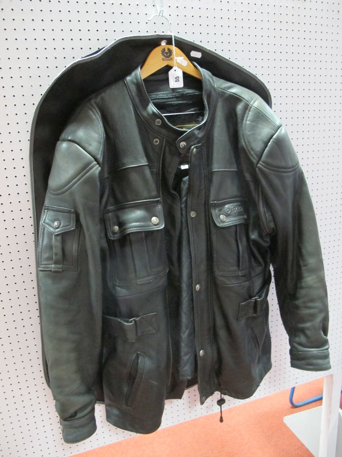 A Black Leather Belstaff Jacket, belted, size 46, gently worn in, with hanger and cover