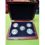 A Set of Five modern Alfa Romeo Grill Badges in Presentation Wooden Box (1910-1972).