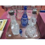 Two Claret Jugs, with plated mask pourers, blue flash glass decanter, Doulton and whisky decanters:_