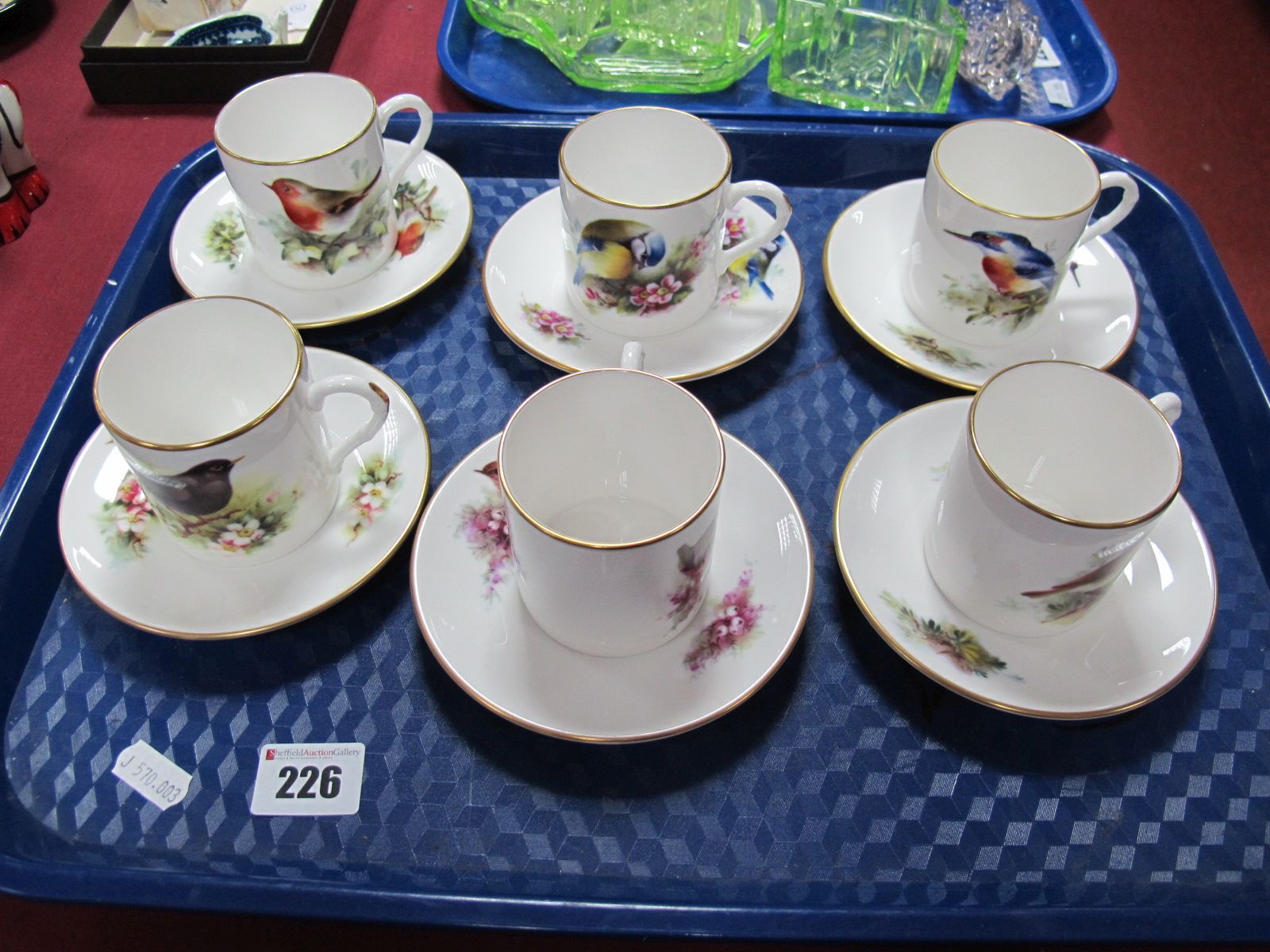 A Royal Worcester ' Best Loved Birds' Coffee Service, comprising six coffee cans and six saucers for