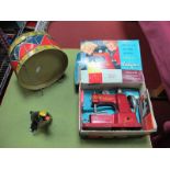 Three Mid XX Century Tin Toys. A Boxed Vulcan sewing machine, a clockwork penguin and tin drum.