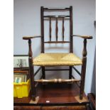 XIX Century Ash Armchair, with rail supports, shaped arms, rushed seat, turned legs, united