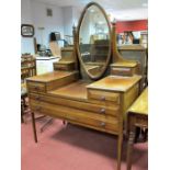 An Edwardian Mahogany Dressing Table, oval bevelled mirror, with finial capped shaped supports and